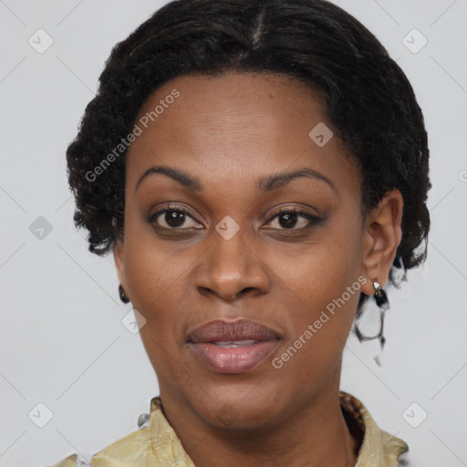 Joyful black adult female with short  brown hair and brown eyes