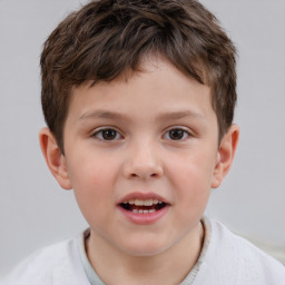 Joyful white child male with short  brown hair and brown eyes