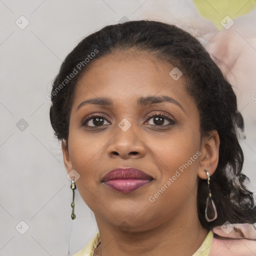 Joyful black young-adult female with medium  brown hair and brown eyes