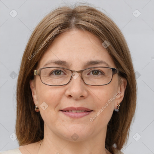 Joyful white adult female with medium  brown hair and grey eyes