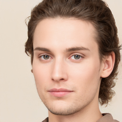 Neutral white young-adult male with long  brown hair and brown eyes