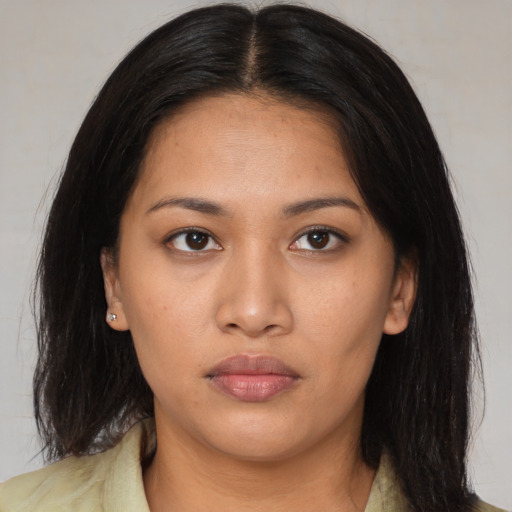 Neutral asian young-adult female with medium  brown hair and brown eyes
