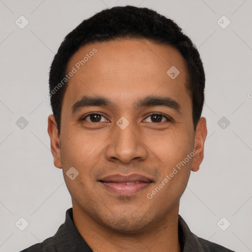 Joyful latino young-adult male with short  black hair and brown eyes