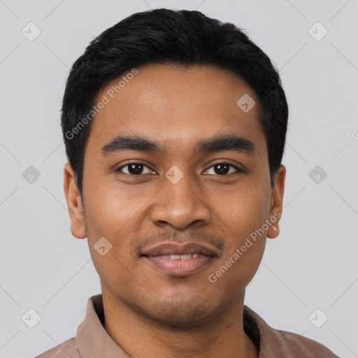 Joyful latino young-adult male with short  black hair and brown eyes