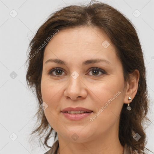 Joyful white adult female with medium  brown hair and brown eyes