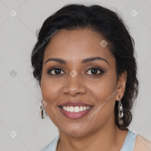 Joyful black young-adult female with long  brown hair and brown eyes