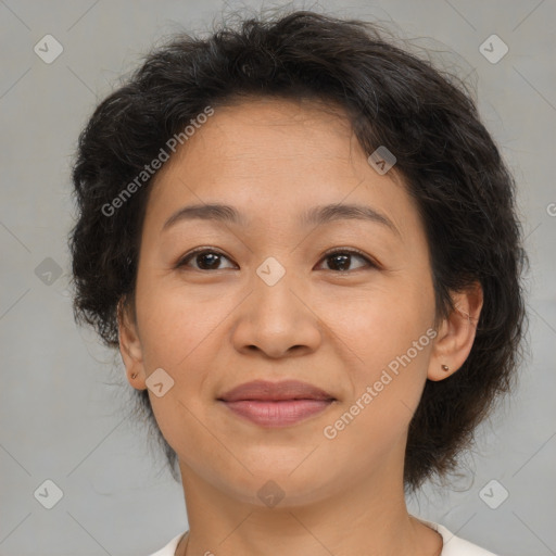 Joyful asian adult female with medium  brown hair and brown eyes