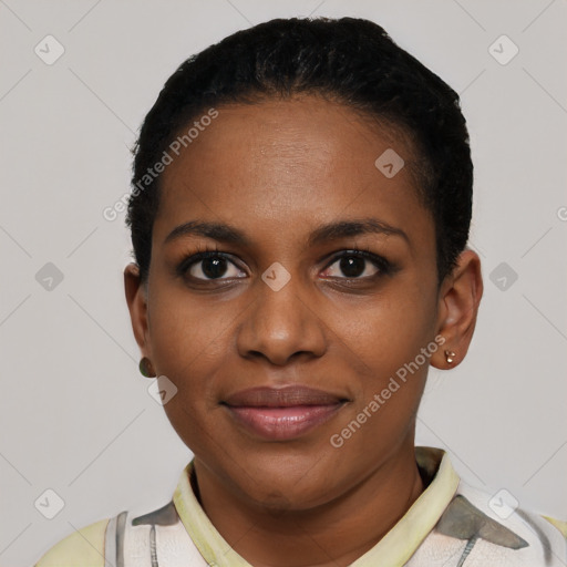 Joyful black young-adult female with short  black hair and brown eyes