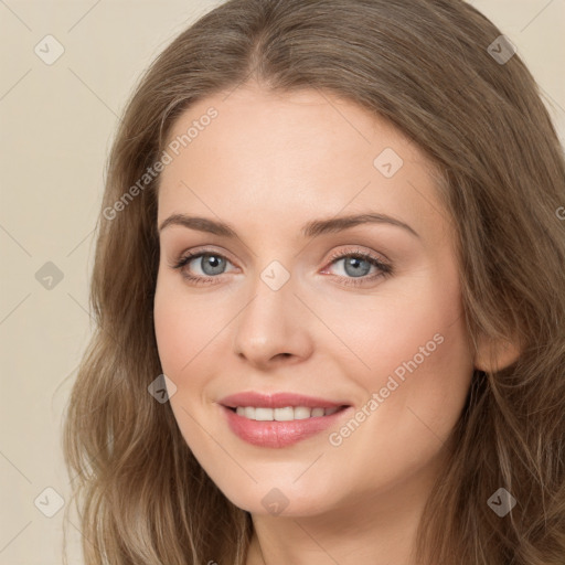 Joyful white young-adult female with long  brown hair and green eyes