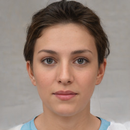 Neutral white young-adult female with short  brown hair and brown eyes