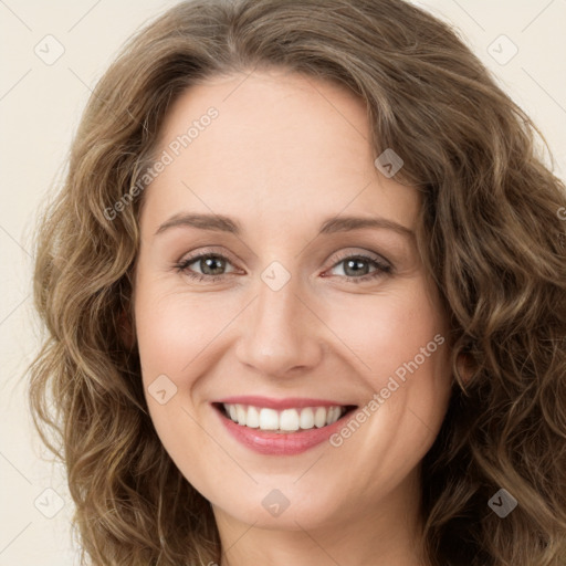 Joyful white young-adult female with long  brown hair and green eyes