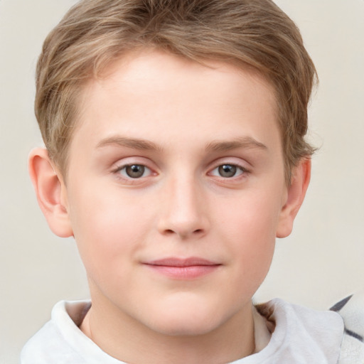 Joyful white child male with short  brown hair and grey eyes