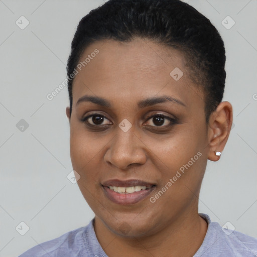 Joyful black young-adult female with short  black hair and brown eyes