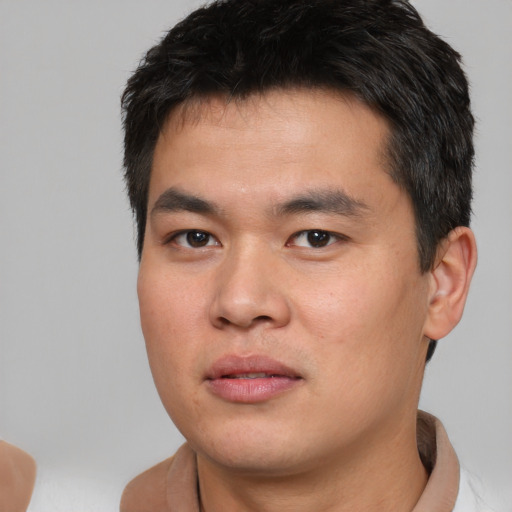 Neutral asian young-adult male with short  black hair and brown eyes