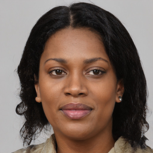 Joyful black young-adult female with medium  black hair and brown eyes
