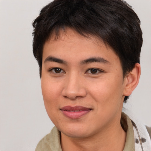 Joyful asian young-adult female with short  brown hair and brown eyes
