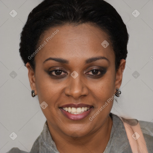 Joyful black adult female with short  black hair and brown eyes