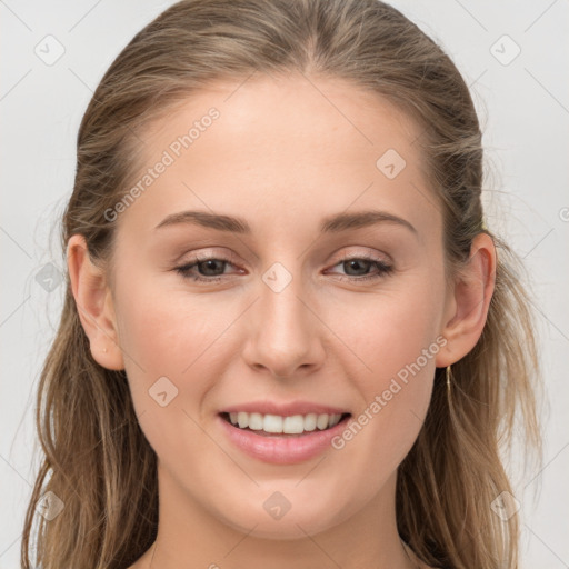 Joyful white young-adult female with long  brown hair and grey eyes