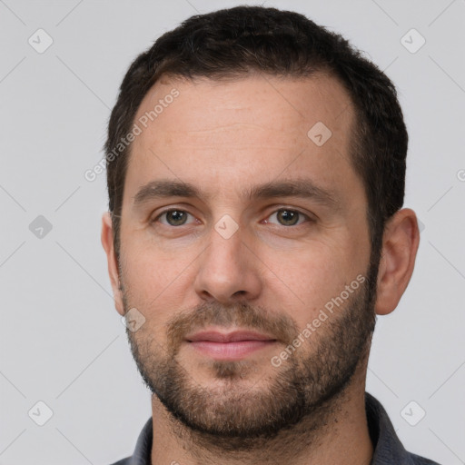 Neutral white young-adult male with short  brown hair and brown eyes