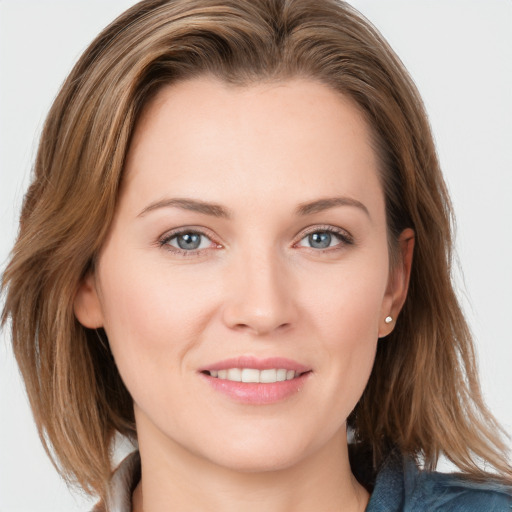 Joyful white young-adult female with long  brown hair and grey eyes