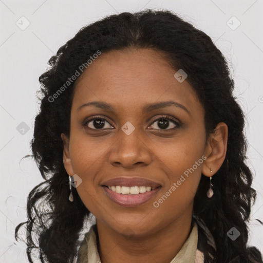 Joyful black young-adult female with long  brown hair and brown eyes