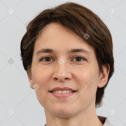 Joyful white adult female with short  brown hair and brown eyes