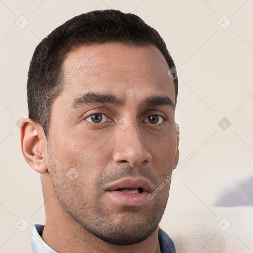 Neutral white young-adult male with short  brown hair and brown eyes