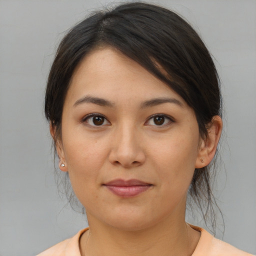 Joyful asian young-adult female with medium  brown hair and brown eyes