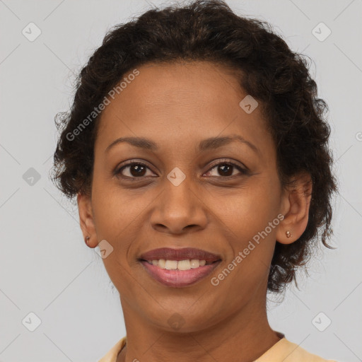 Joyful latino adult female with short  brown hair and brown eyes