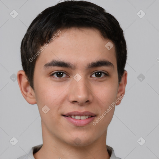 Joyful asian young-adult male with short  brown hair and brown eyes