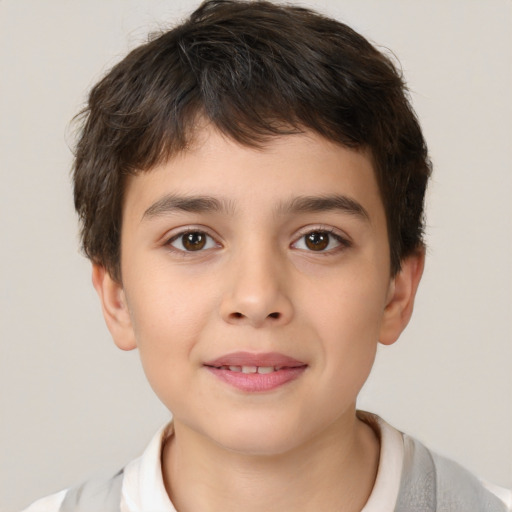 Joyful white child male with short  brown hair and brown eyes