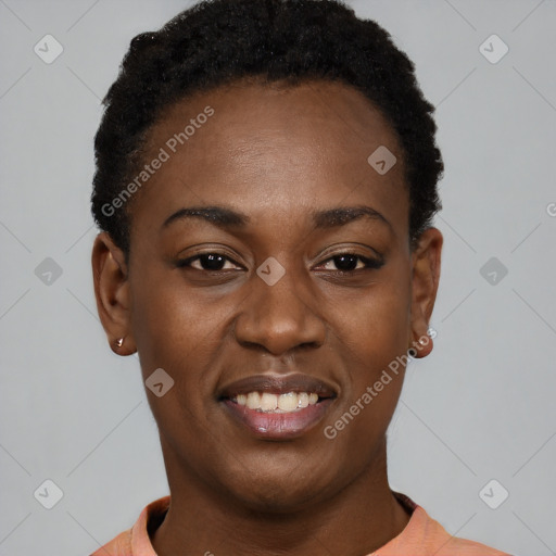 Joyful black young-adult female with short  black hair and brown eyes