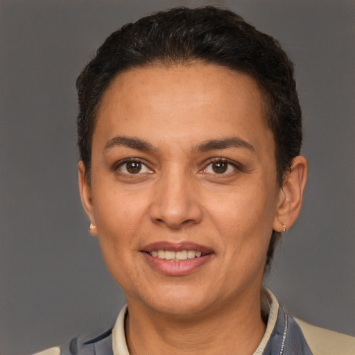 Joyful white adult female with short  brown hair and brown eyes