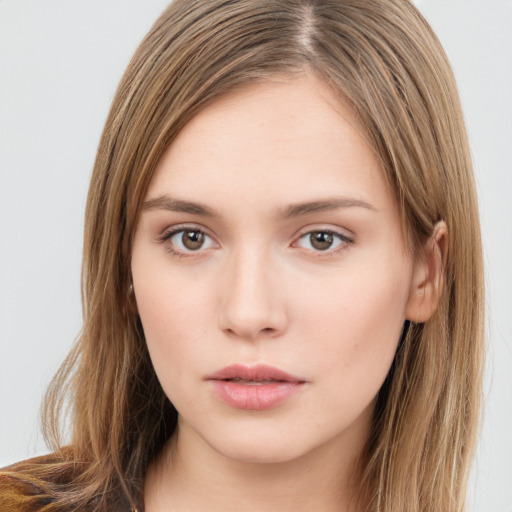 Neutral white young-adult female with long  brown hair and brown eyes