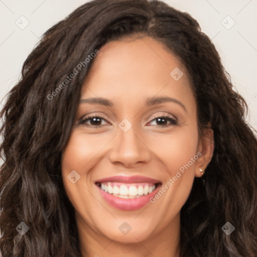 Joyful latino young-adult female with long  brown hair and brown eyes