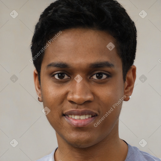 Joyful black young-adult male with short  black hair and brown eyes