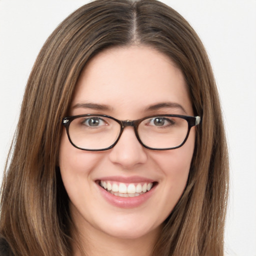 Joyful white young-adult female with long  brown hair and green eyes