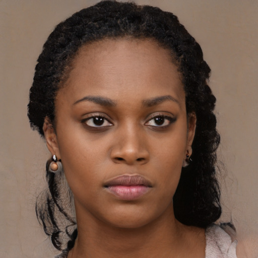 Neutral black young-adult female with long  brown hair and brown eyes
