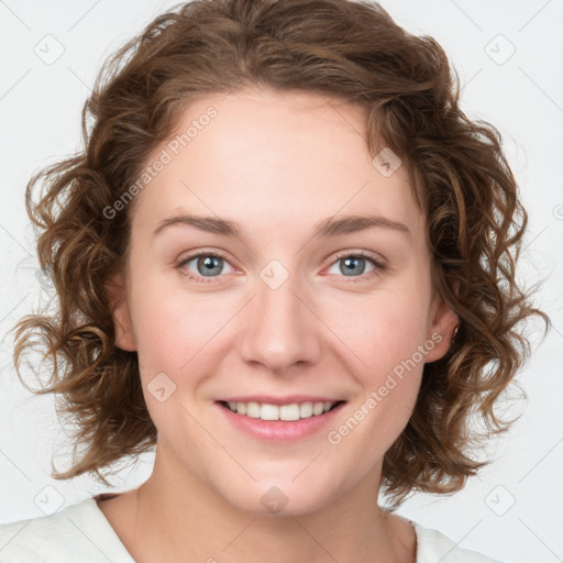 Joyful white young-adult female with medium  brown hair and green eyes