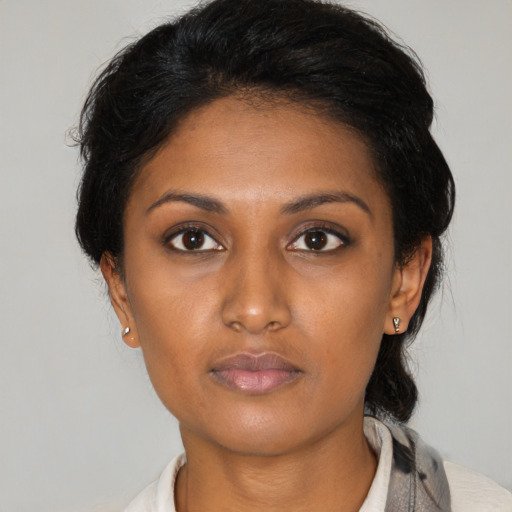 Neutral latino young-adult female with medium  black hair and brown eyes