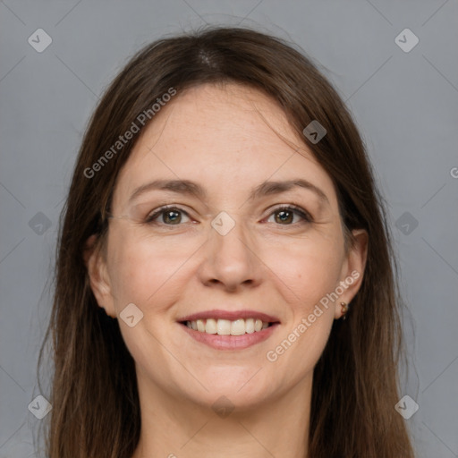 Joyful white adult female with medium  brown hair and grey eyes