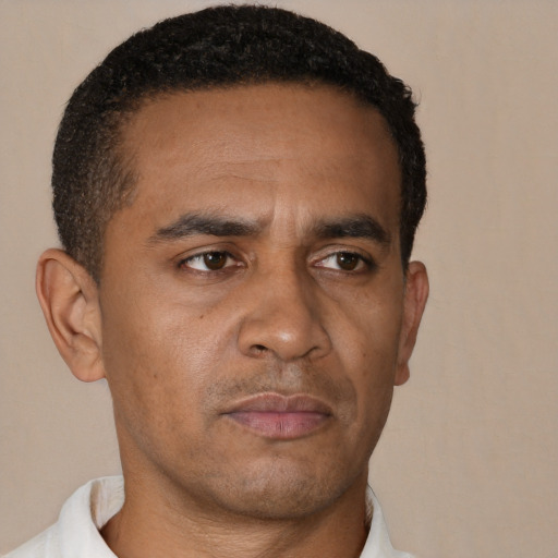 Neutral black adult male with short  black hair and brown eyes