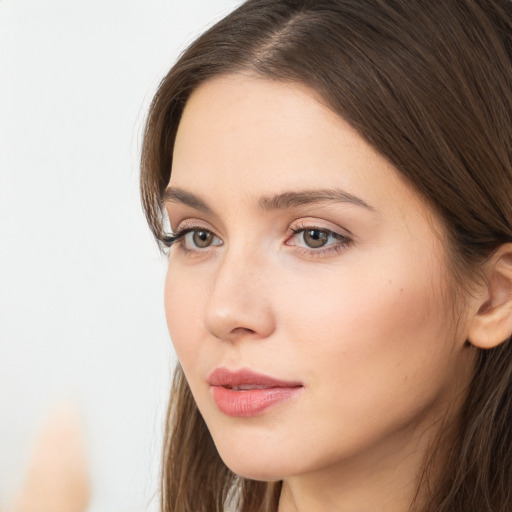 Neutral white young-adult female with long  brown hair and brown eyes