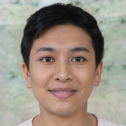 Joyful asian young-adult female with short  black hair and brown eyes