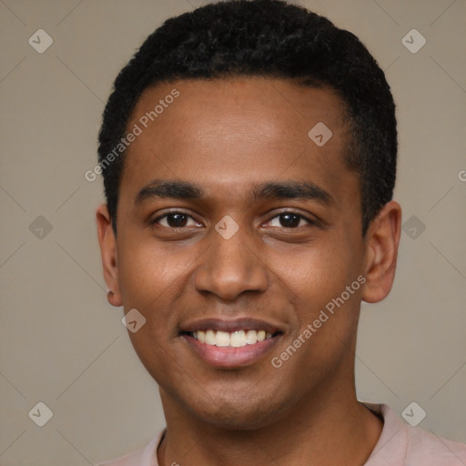 Joyful black young-adult male with short  black hair and brown eyes