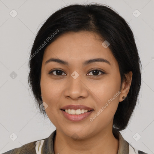 Joyful latino young-adult female with medium  brown hair and brown eyes