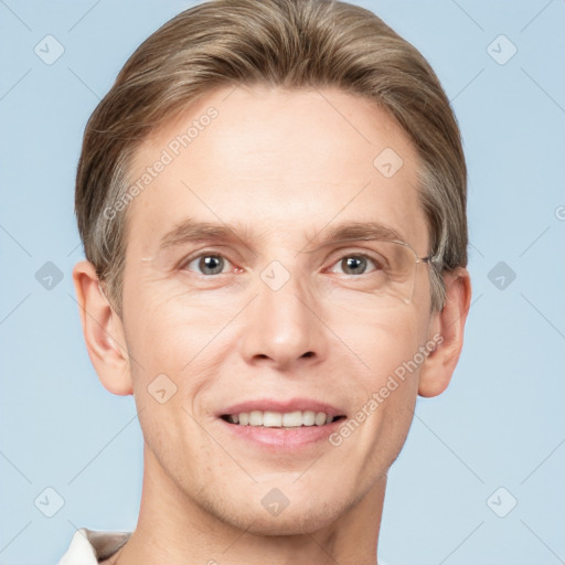 Joyful white adult male with short  brown hair and grey eyes