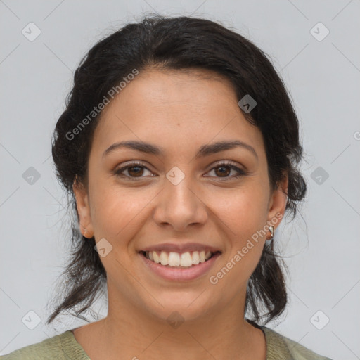 Joyful latino young-adult female with medium  brown hair and brown eyes