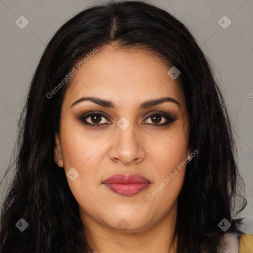 Joyful latino young-adult female with long  brown hair and brown eyes