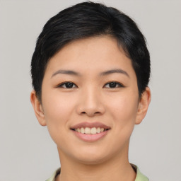 Joyful asian young-adult female with short  black hair and brown eyes